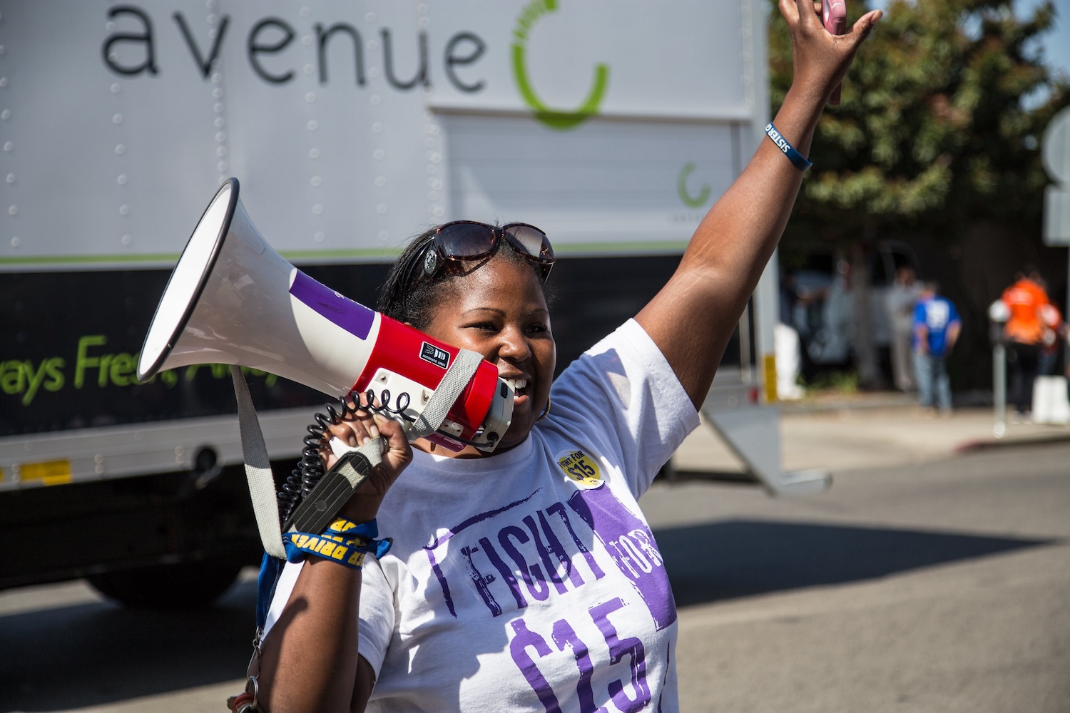 A demonstrator with the Service Employees International Union participates in a Fight for $15 rally in Los Angeles on April 15